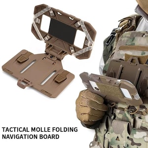 May include: A tan tactical MOLLE folding navigation board. The board is open, revealing a black rectangle and clear elastic straps. The text "TACTICAL MOLLE FOLDING NAVIGATION BOARD" is printed at the bottom.
