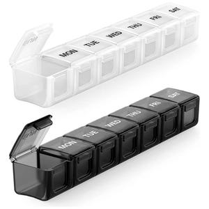 May include: Two weekly pill organisers. One is clear, the other black. Each has seven compartments, labelled for each day of the week. One lid is open on each, revealing the interior.