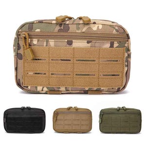 May include: Camouflage-patterned tactical pouch with a tan front panel featuring horizontal slots. The pouch has a zipper closure and a small loop. Additional pouches in black, tan, and olive green are shown below.