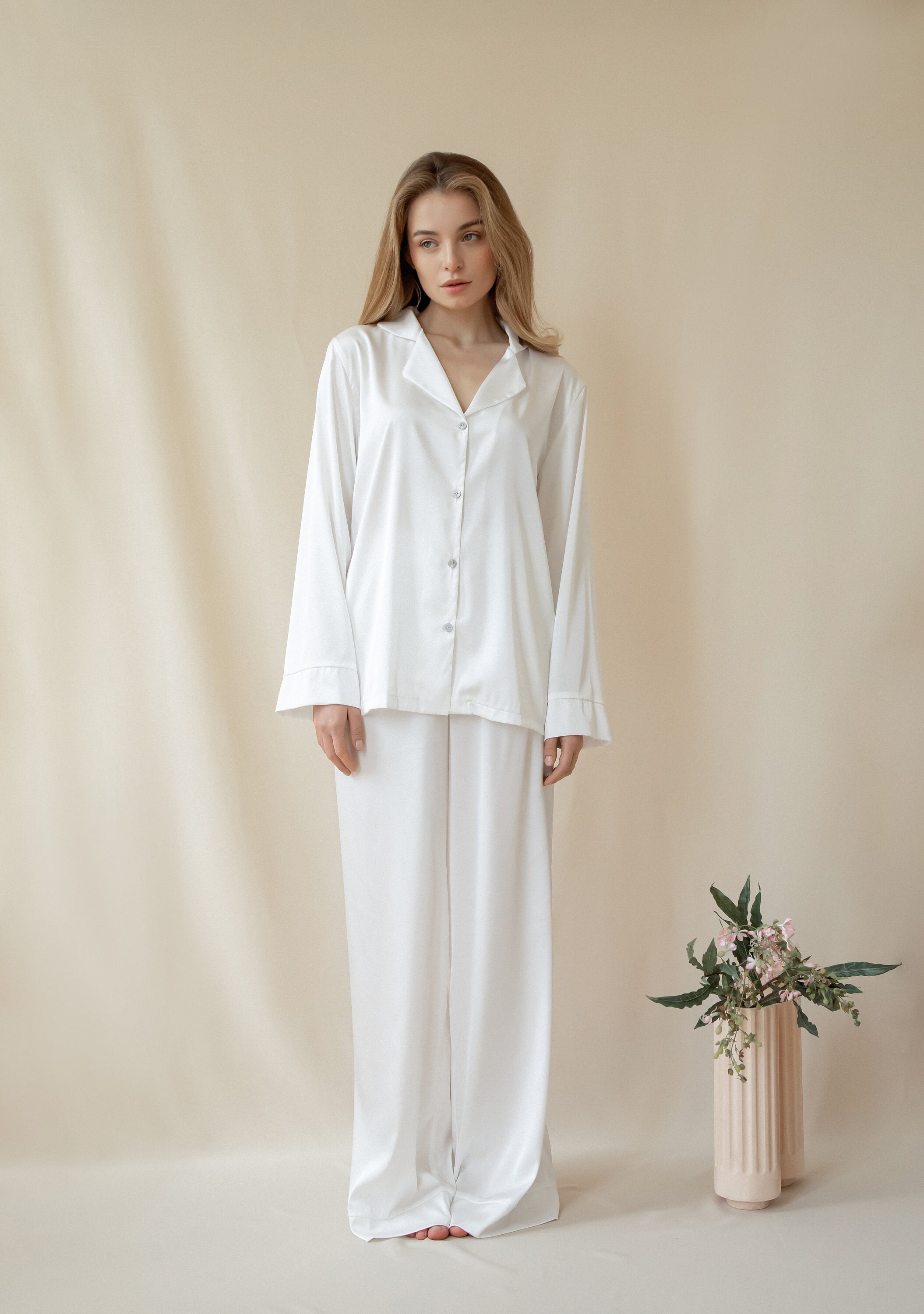 A SET OF WHITE SILK MONOGRAM PAJAMAS WITH SILVER HARDWARE BY