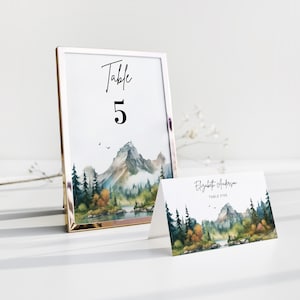 Tarjetas con números de mesa para bodas en la montaña, plantilla de tarjetas de lugar imprimibles con íconos para elegir comidas, números de mesa de pino rústico editables