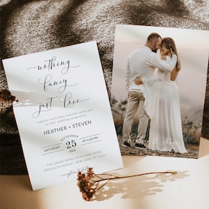 May include: Wedding invitation with a simple design featuring the text "nothing fancy just love" and the couple's names Heather and Steven. The invitation includes the date, time, and location of the wedding ceremony.