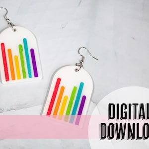 May include: A pair of rainbow-colored bar graph earrings. The earrings are white with a rainbow-colored bar graph design. The earrings are made of resin and have silver hooks.
