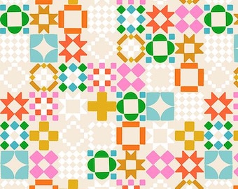 May include: A fabric print featuring a repeating geometric quilt pattern in shades of orange, mustard yellow, bright pink, teal, and green on a cream background, with a black ruler at the bottom showing 7 inches of length.