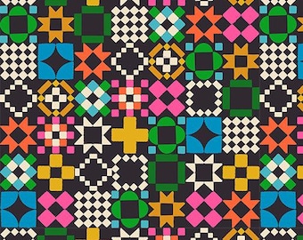May include: A dark charcoal fabric featuring a repeating geometric quilt block pattern in vibrant shades of orange, pink, yellow, green, and blue, with white accents. A ruler at the bottom shows measurements in inches, labeled Ruby Star Society.