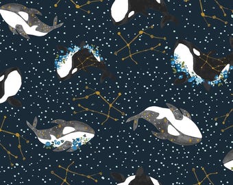 May include: A repeating pattern featuring orca whales in black and white, adorned with floral accents and constellations. The background is a dark navy blue with white dots, creating a starry night effect.