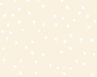 May include: A light cream-colored background featuring a repeating pattern of small, hand-drawn white stars scattered across the surface. The stars vary slightly in orientation and placement, creating a simple, consistent, and uniform graphic design.