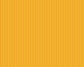 May include: A close-up of a fabric with a vertical striped pattern. The fabric has a yellow background with thin, vertical orange stripes. A ruler is at the bottom of the image, with the text "Free Spirit" and "freespiritfabrics.com".