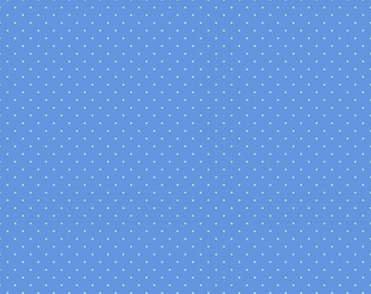 May include: A blue fabric with a repeating pattern of small white dots. The fabric has a ruler along the bottom edge, marked in inches. The text "Free Spirit" and "freespiritfabrics.com" are also visible.