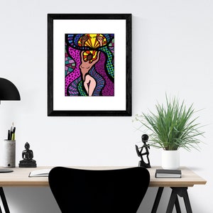 May include: A framed print of a colorful abstract illustration of a person with a bright yellow sun above their head. The illustration is in a black frame and is hanging on a white wall.