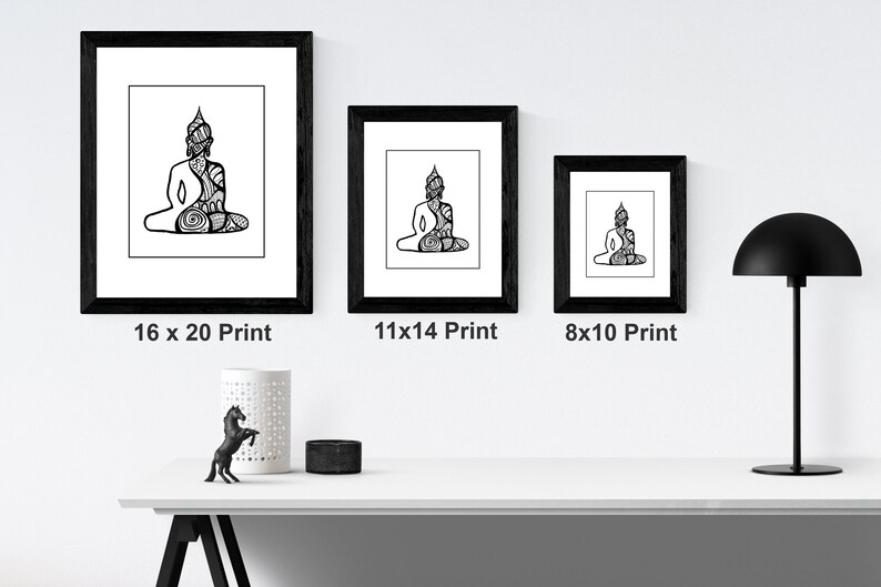 May include: Three black framed prints of a line drawing of a meditating Buddha. The prints are in different sizes: 16x20, 11x14, and 8x10 inches.