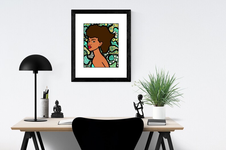 May include: A framed illustration of a woman with an afro hairstyle. The woman is looking to the right and has a red lip. The background is a colorful abstract pattern in shades of green, blue, and yellow.