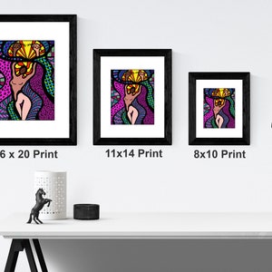 May include: Three framed prints of a colorful abstract illustration of a woman with a crown of flowers. The prints are in black frames and are displayed on a white shelf. The prints are available in three sizes: 16x20, 11x14, and 8x10 inches.