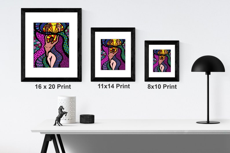 May include: Three framed prints of a colorful abstract illustration of a woman with a crown of flowers. The prints are in black frames and are displayed on a white shelf. The prints are available in three sizes: 16x20, 11x14, and 8x10 inches.