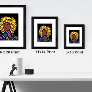 May include: Three framed prints of a colorful illustration of a woman with a large afro. The prints are in black frames and are labeled 16 x 20 Print, 11 x 14 Print, and 8 x 10 Print.