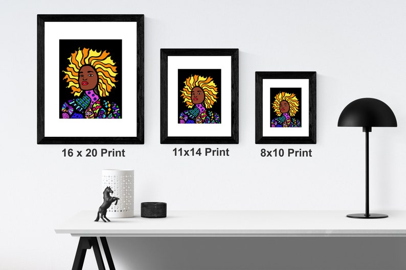 May include: Three framed prints of a colorful illustration of a woman with a large afro. The prints are in black frames and are labeled 16 x 20 Print, 11 x 14 Print, and 8 x 10 Print.