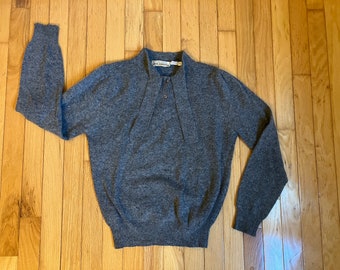 May include: A gray long-sleeved sweater with a button-up collar and a small label that reads "Max Studio".