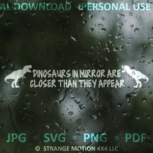 May include: A white vinyl decal with a silhouette of a dinosaur and the text "Dinosaurs in mirror are closer than they appear". The decal is on a dark background with water droplets.