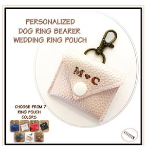 May include: Personalized pink leather dog ring bearer pouch with a gold metal clip and the initials "M & C" embossed on the front.  Choose from 7 ring pouch colors.