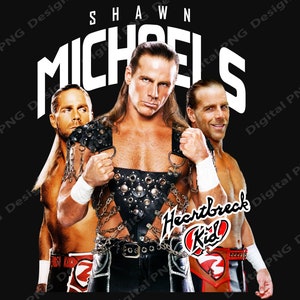 May include: A black and white image of three wrestlers. The wrestler in the center is wearing a black leather vest with chains and a black belt. He is holding his fist up in the air. The wrestler on the left is wearing a red and black wrestling outfit. The wrestler on the right is wearing a red, white, and blue wrestling outfit. The text "Shawn Michaels" is written in white letters across the top of the image. The text "Heartbreak Kid" is written in black letters with a red heart around it.