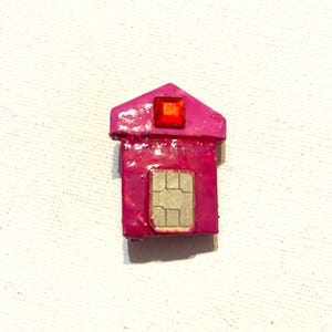 May include: A set of three ceramic mugs with a speckled, matte finish. The mugs are in shades of cream, light gray, and dark gray. Each mug has a simple, minimalist design and a rounded handle.