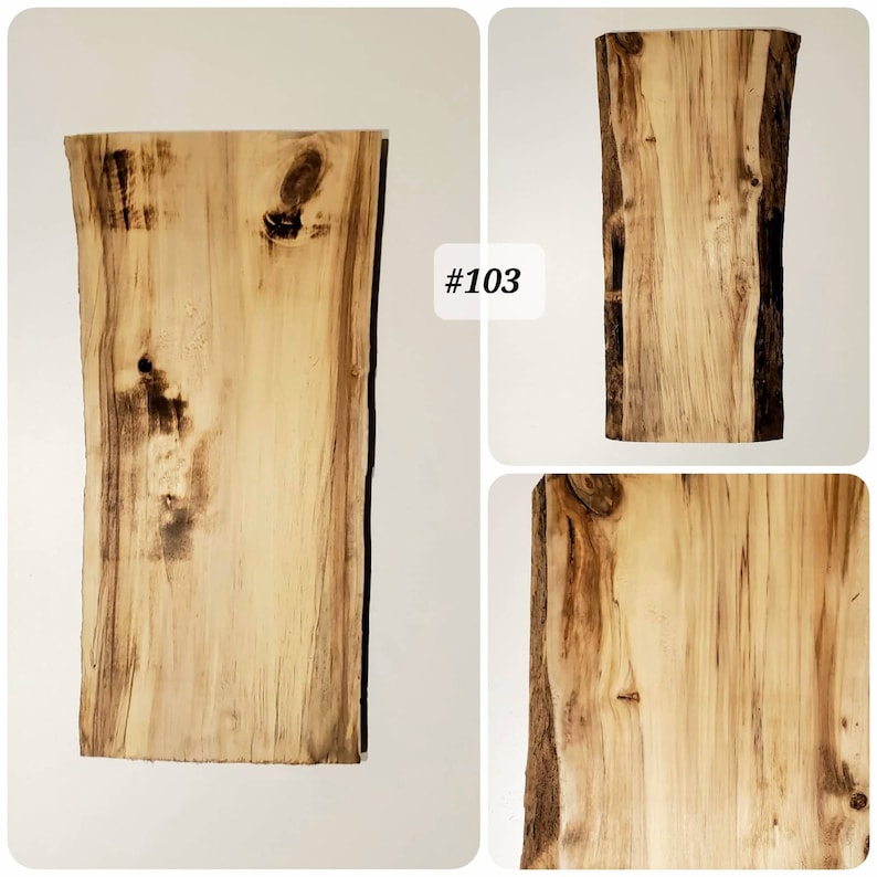 Puede incluir: Una gran losa de madera natural con un borde vivo. La madera tiene un color marr&oacute;n claro con vetas y nudos marrones oscuros. La losa es #103.