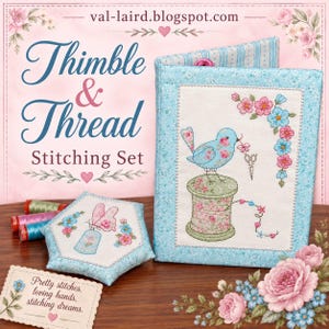 May include: A fabric stitching set featuring a light blue quilted needle book with an embroidered blue bird on a spool, a hexagonal pincushion with a butterfly motif, and three spools of thread, all decorated with floral patterns and pink hearts.