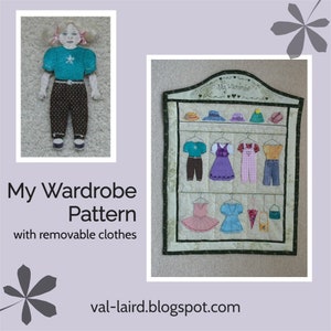 May include: A felt doll with removable clothes. The doll is wearing a brown skirt and a blue shirt with a star. The doll is hanging on a felt wardrobe with the text "My Wardrobe" on it. The wardrobe has different felt clothes hanging on it.