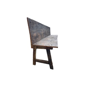 May include: A rustic wooden bench featuring a weathered dark brown finish with visible wood grain, cracks, and knots. The bench has a high backrest, a flat seat, and sturdy angled legs connected by a horizontal support beam, secured with metal nails.