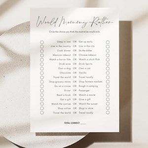 May include: A printable "Would Mommy Rather" game with a list of 14 questions for a baby shower or party. Each question has two choices, and the player circles their answer. The game is designed to be fun and engaging for guests.