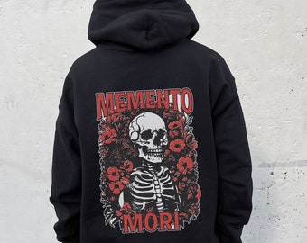 May include: Black hooded sweatshirt with a red skull and floral graphic on the back. The graphic says "Memento Mori".