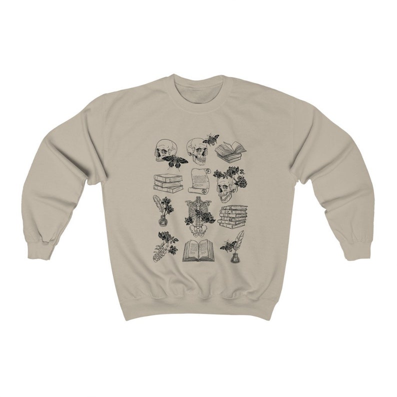 May include: A beige sweatshirt with a black and white print of various anatomical illustrations, including skulls, books, and flowers.
