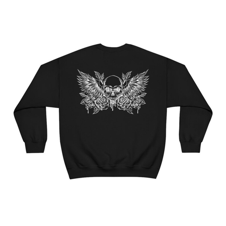 May include: Black sweatshirt with a white graphic of a skull with wings and roses.