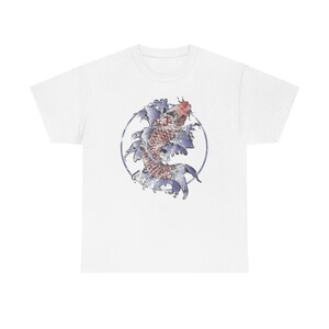 May include: White t-shirt with a graphic of a red and white koi fish swimming in a circle of blue water.