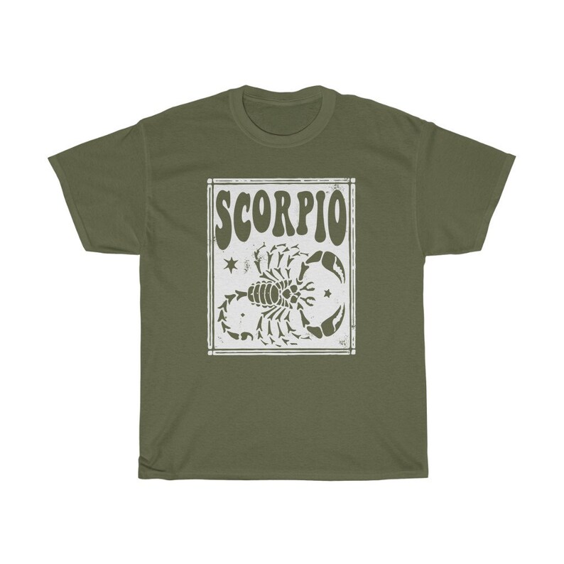 May include: A green t-shirt with a white graphic of a scorpion and the word "SCORPIO" in a retro font.