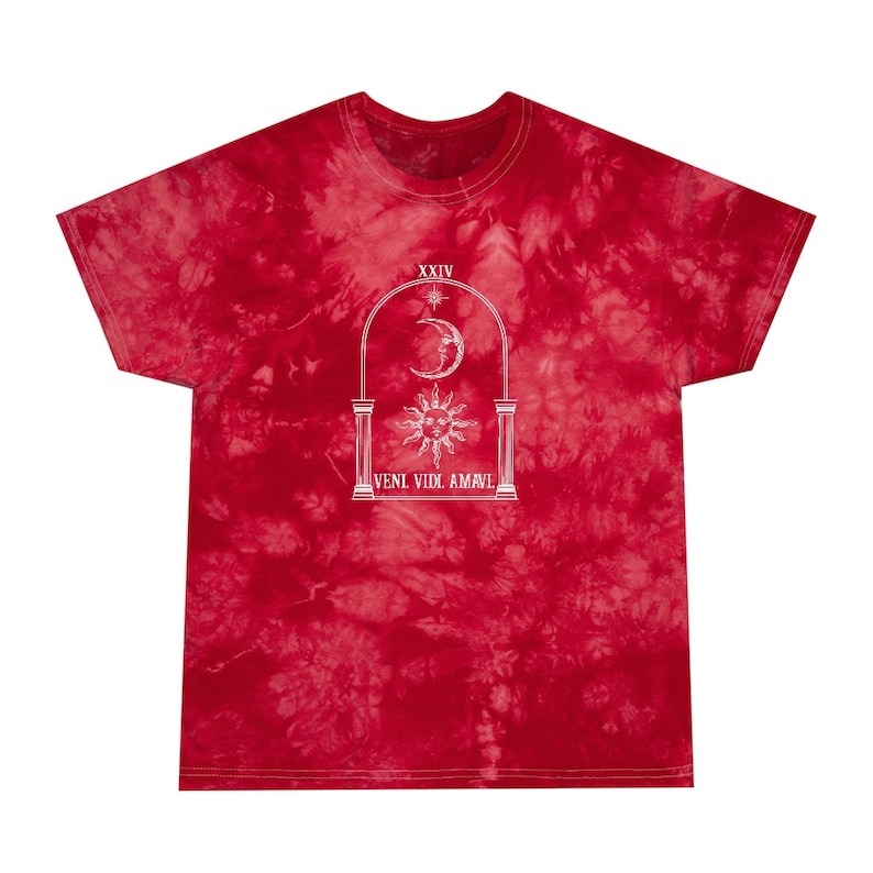 May include: Red tie-dye t-shirt with a white graphic of a sun, moon, and stars in an archway with the text "VENI VIDI AMAVI" and "XXIV" above the archway.