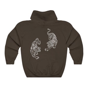 May include: A dark brown hooded sweatshirt with a white graphic of two tigers facing each other.
