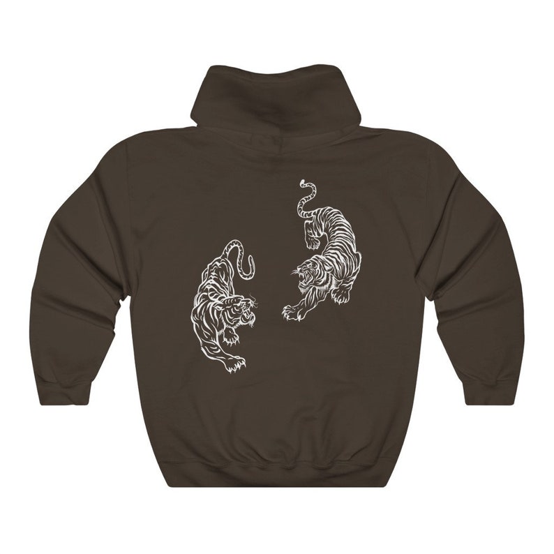 May include: A dark brown hooded sweatshirt with a white graphic of two tigers facing each other.
