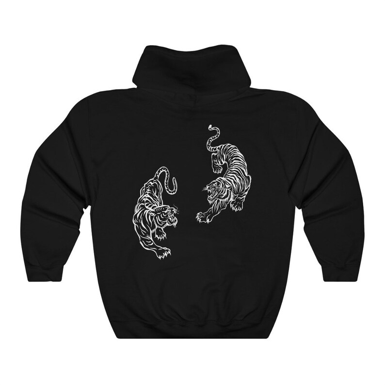 May include: Black hooded sweatshirt featuring a white outline of two tigers facing each other.
