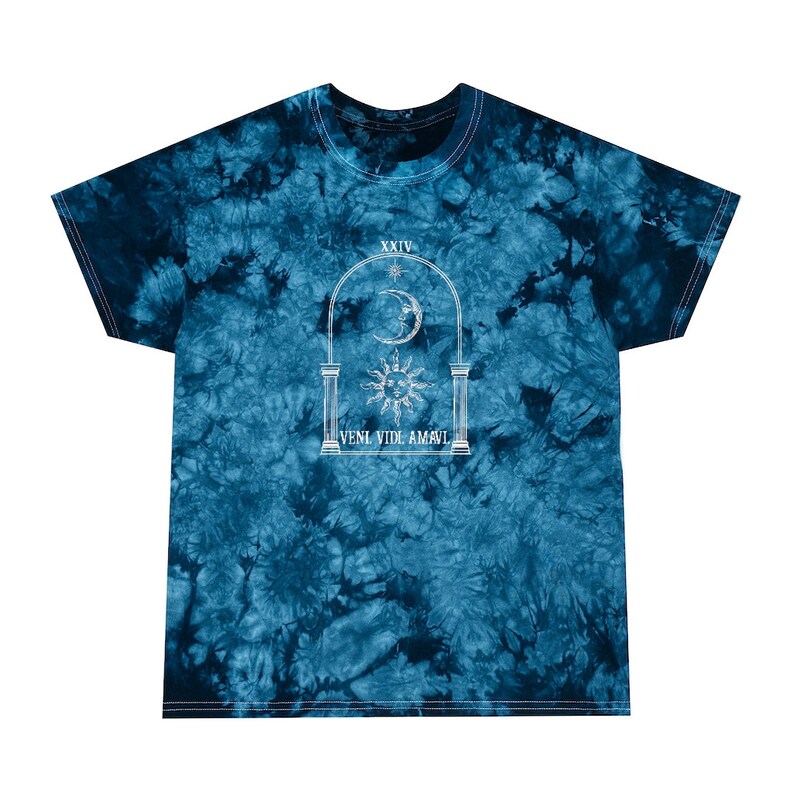 May include: A blue tie-dye t-shirt with a white graphic of an archway with a sun and moon inside. The text "VENI VIDI AMAVI" is written below the archway.