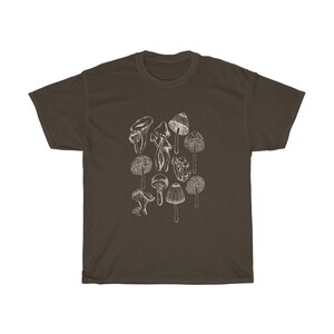 May include: A brown t-shirt with a white graphic of various mushrooms.