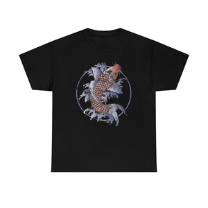 May include: Black t-shirt with a graphic of a red and white koi fish swimming in a circle of blue water.
