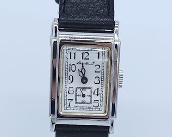 Vintage Extremely Rare Eddie Bauer 70Th Anniversary Tank Watch Silver Tone, Black Original Strap with 1 Jewel Japan movement