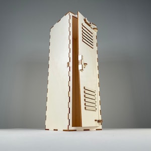 May include: A tall, light-coloured wooden box with a hinged door, featuring a series of horizontal cut-out slats. The box has a rectangular shape with a slightly tapered design. The door is partially open, revealing the interior.