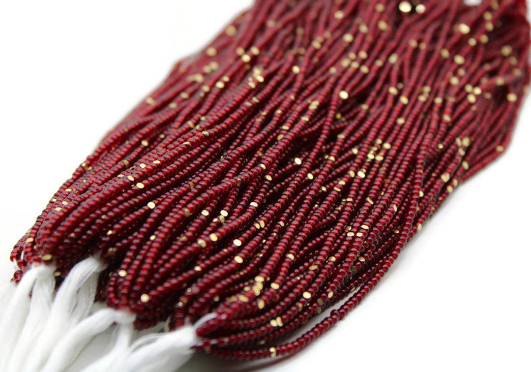 11/0 Charlotte Cut Beads, Tr. Red With Gold Gleams. 1/3/5 Hanks