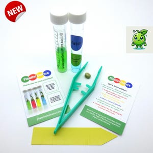 May include: A green plastic tweezers, two clear test tubes with green and blue liquid, a green seed, and a card with instructions for growing a plantlet. The card says "Plantlet Culture" and includes instructions for using the tweezers, seed, and gel tubes.