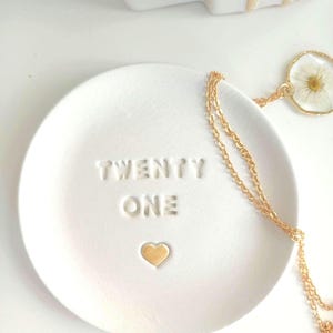 Handmade clay trinket dish embossed with twenty one and a handpainted heart which can be painted in a choice of colours