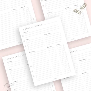 May include: A printable monthly goal planner with sections for focus, goals, key motivations, action plan, duration, and deadline. The planner has a simple, minimalist design with a gray and white color scheme.