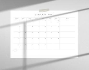 May include: A blank monthly calendar for January 2025 with spaces for notes and plans. The calendar is printed on white paper and has a simple design.