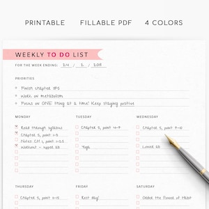 May include: A printable weekly to-do list with a pink header and the text "WEEKLY TO DO LIST". The list includes sections for priorities and daily tasks, with checkboxes for completion. A silver pen with a gold nib rests on the page.